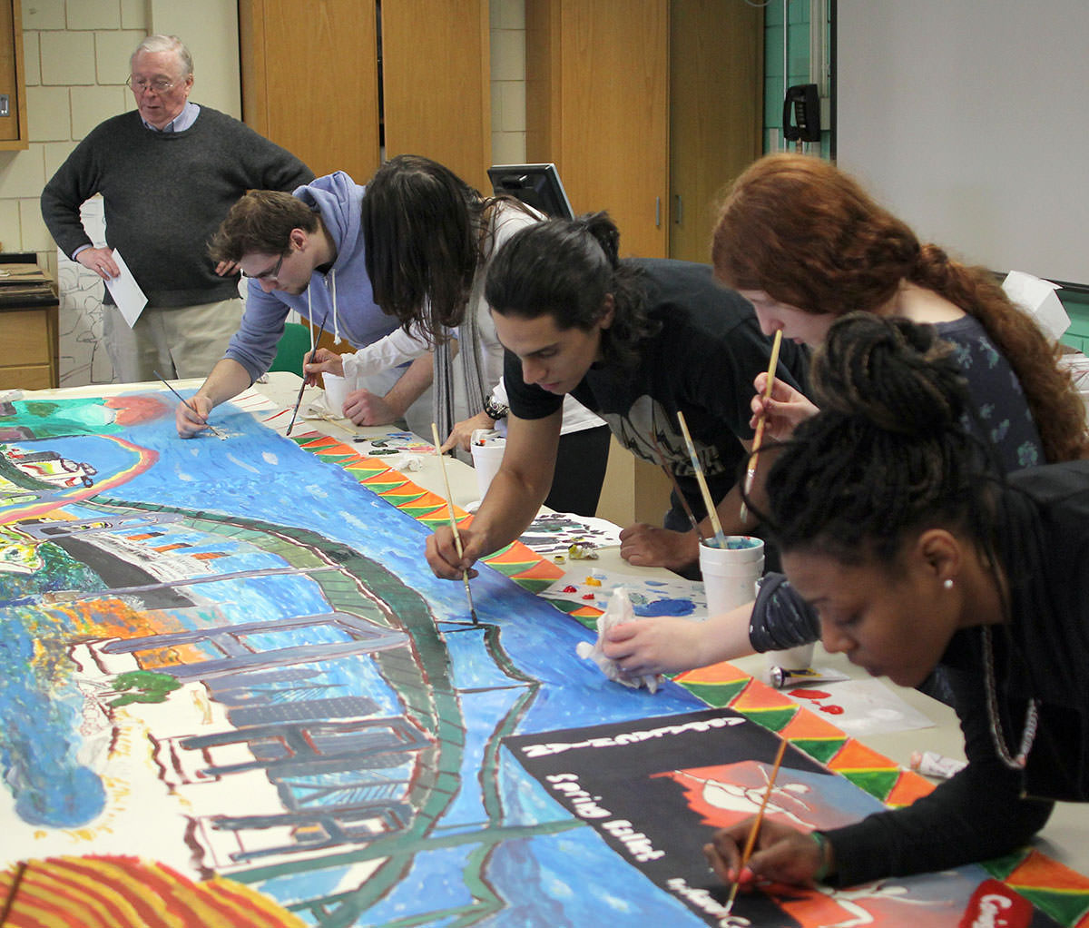 James Chisholm and students from his NSCC drawing class working on the mural